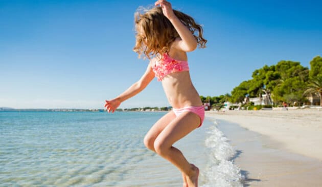 Girl jumping in the sea