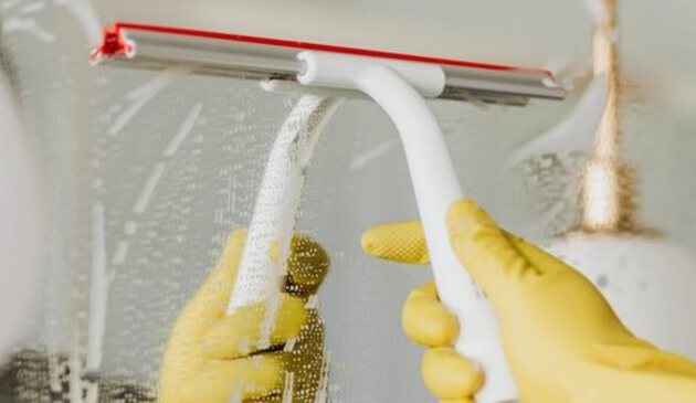 Squeegee being used in shower