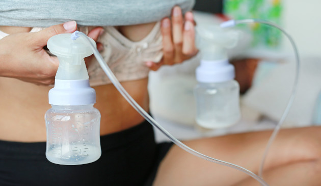 Woman using breast pump