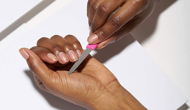 Woman filing nails