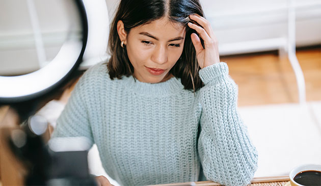 Woman using ring light for work call