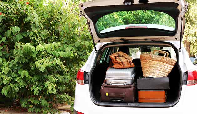 Suitcases in a car boot