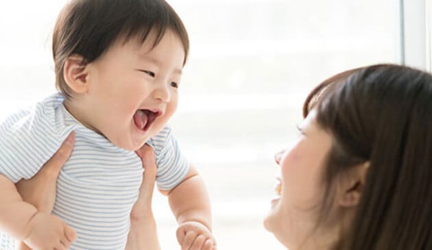 Mother with smiling baby