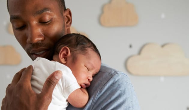 Dad holding baby