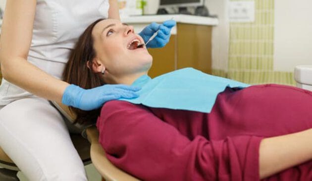 Woman getting a checkup at the dentist
