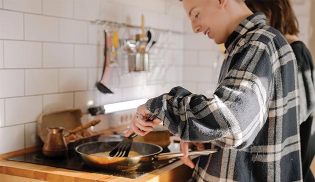 Teenagers cooking in the kitchen