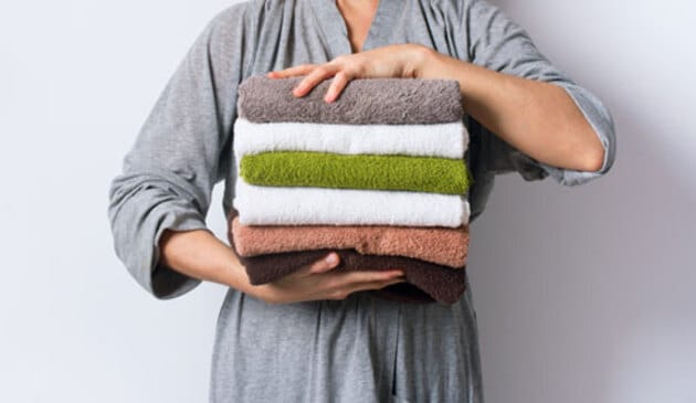 Woman holding towels