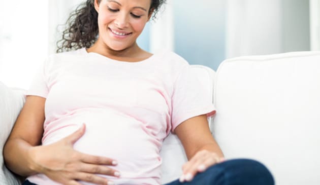 Pregnant woman sitting down