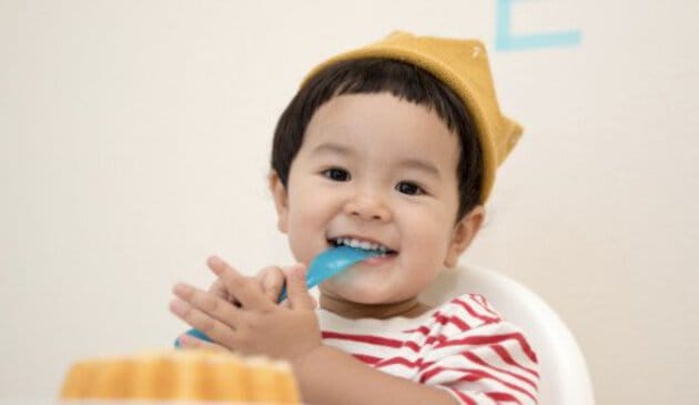 baby eating with fork