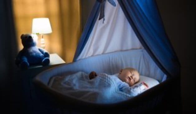 baby sleeping in cot