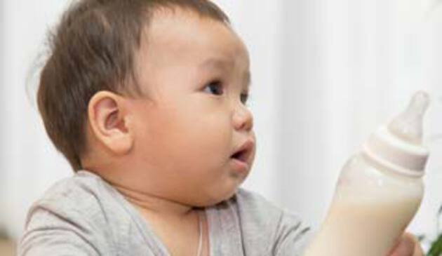 child reach bottle milk
