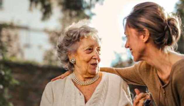 Younger woman with arm around older woman