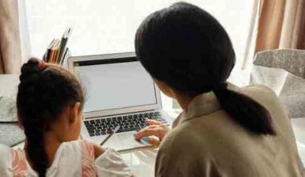 A mother and daughter studying together