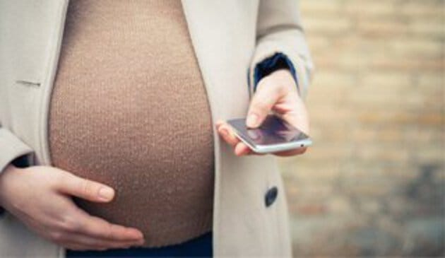 pregnant woman using a phone