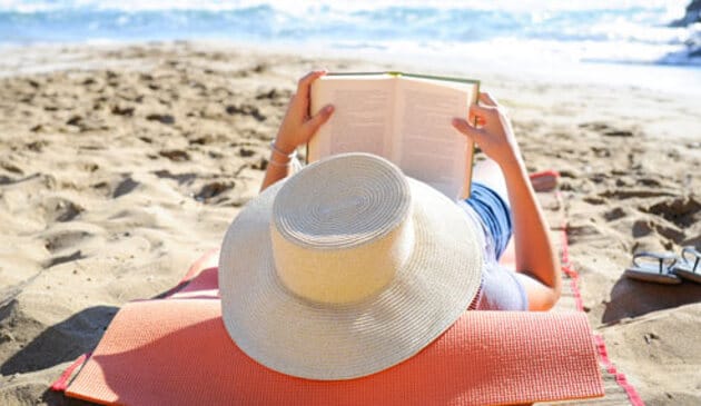 Reading a book on a beach